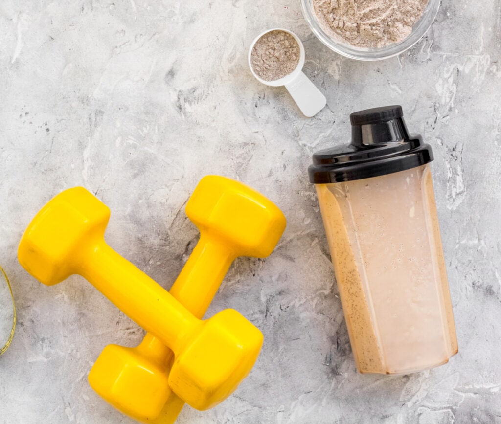 protein powder, protein shake, dumbells