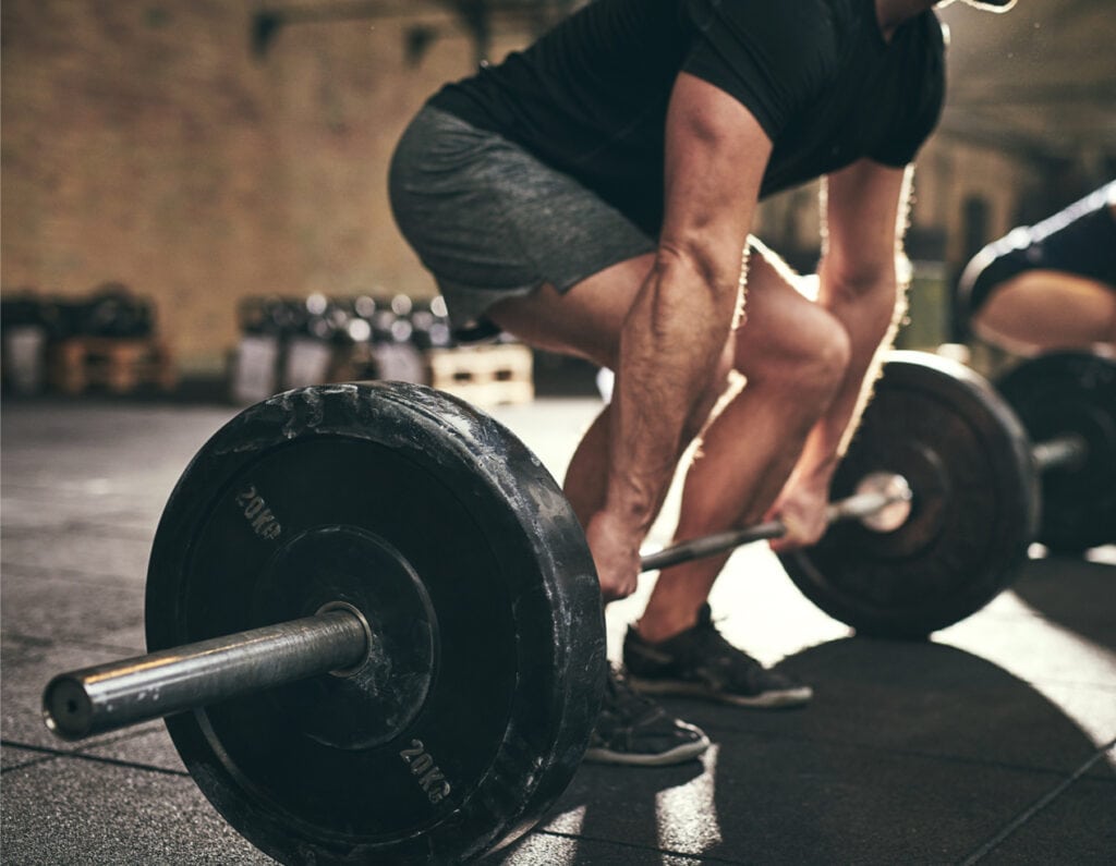 man lifting weights